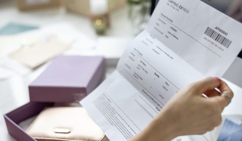 Woman holding bill payment